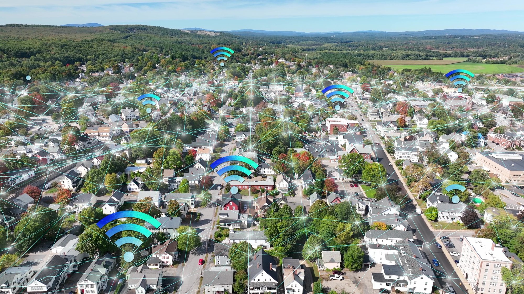 Aerial view of suburban area with digital fiber network overlay illustrating FTTH rollout planning Aerial view of suburban area with digital fiber network overlay illustrating FTTH rollout planning