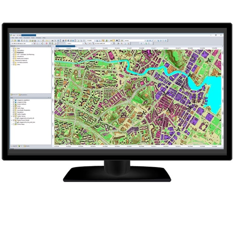 Computer monitor displaying a detailed RF planning tool with a color-coded urban mapping interface for geospatial telecom network analysis.