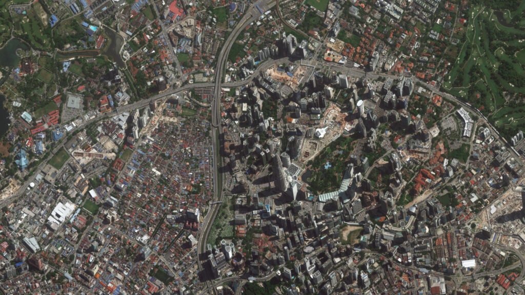 Aerial orthoimage showing detailed cityscape with diverse urban features for geospatial analysis